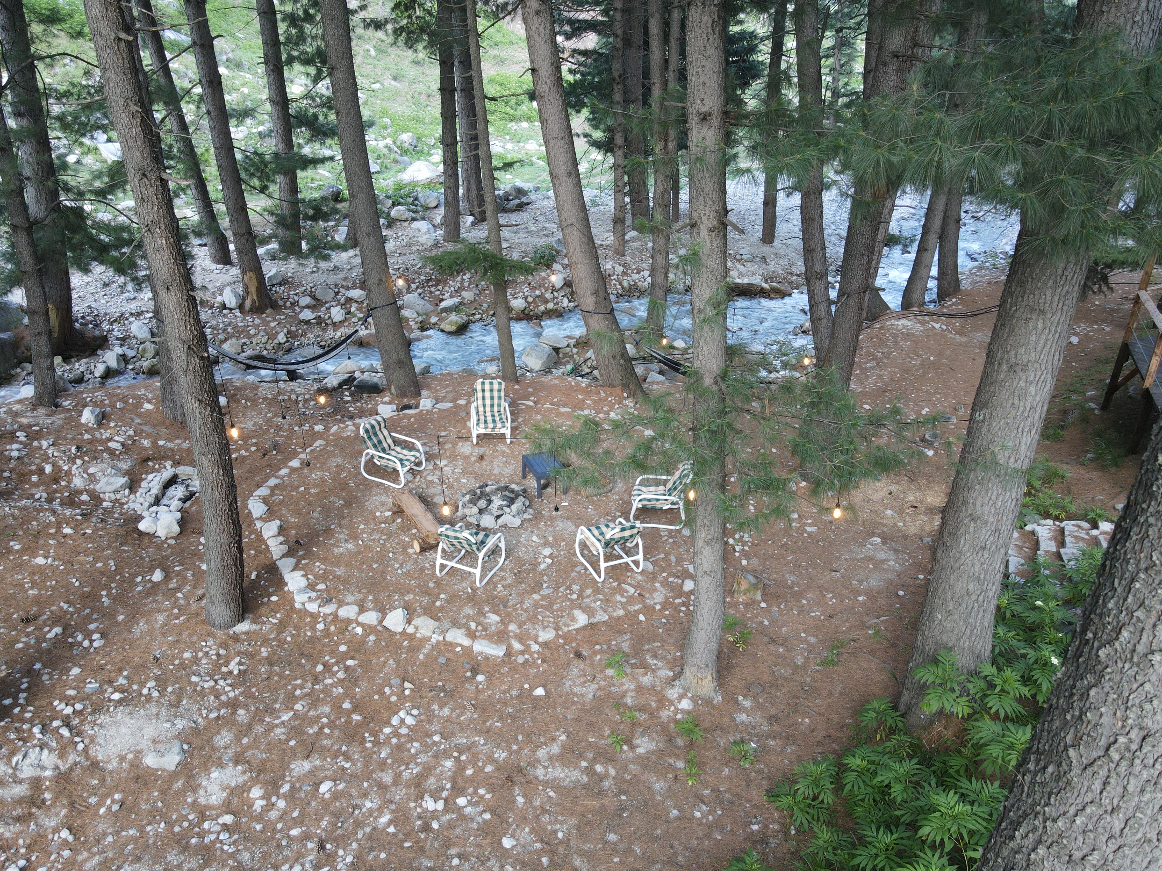 Aerial view of campfire area and stream