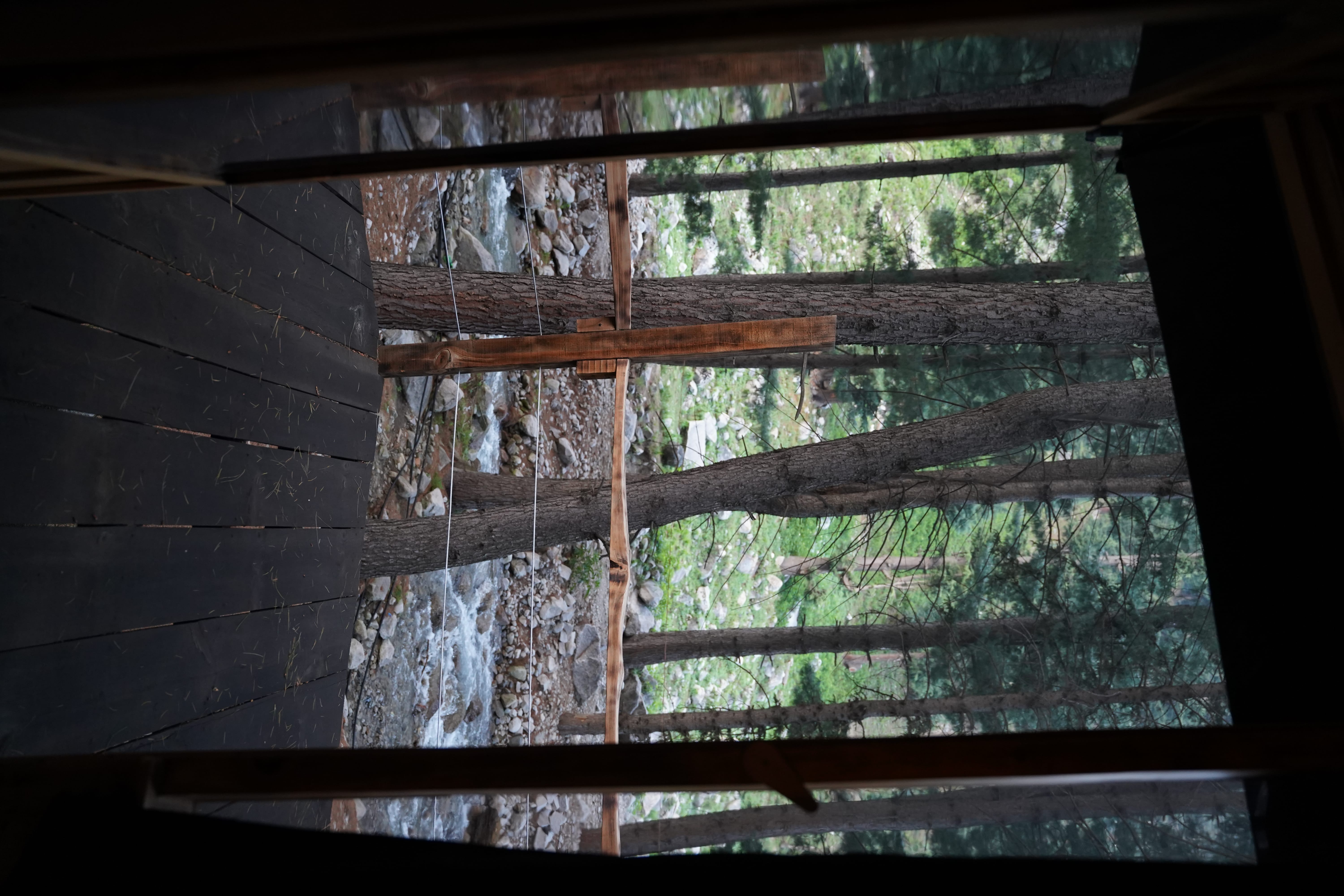 Deck view overlooking stream and forest
