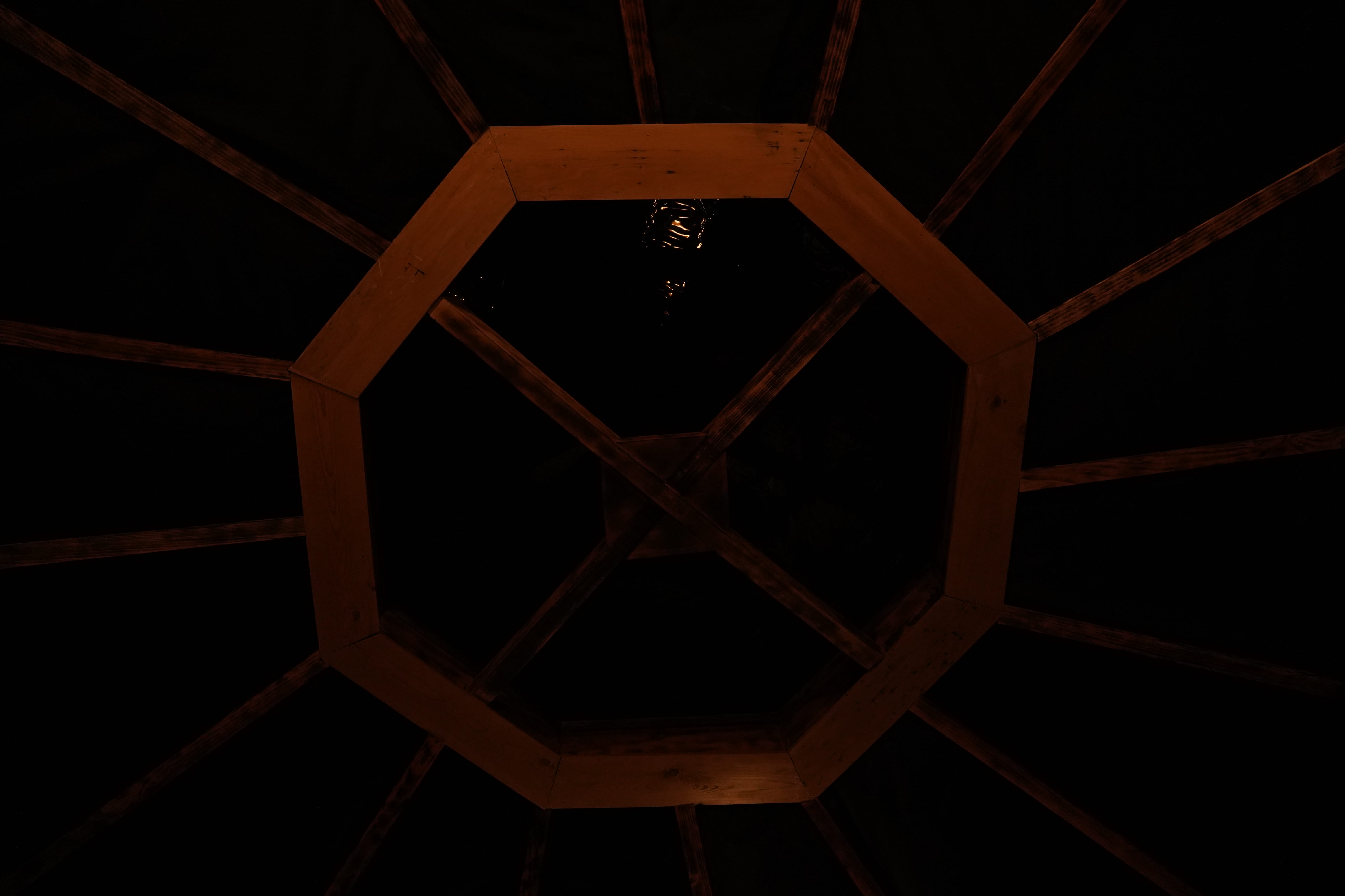 Octagonal wooden skylight at night